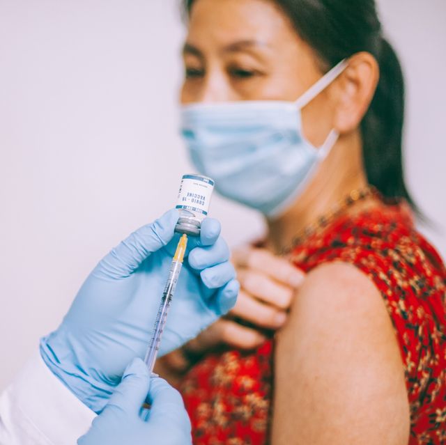 Wear face mask after covid vaccine (source: hips.hearstapps.com)