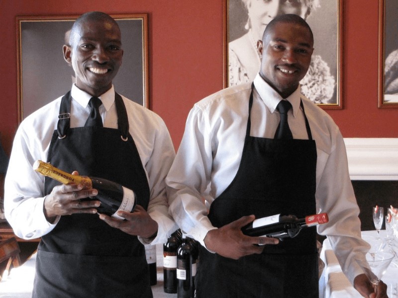 The outfits for waiters are made to be functional and pleasant for the workers.
