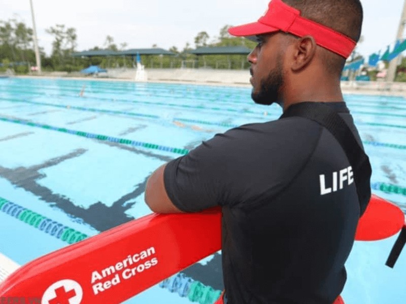 Wearing a lifeguard uniform may occasionally be mandated by law or regulation.
